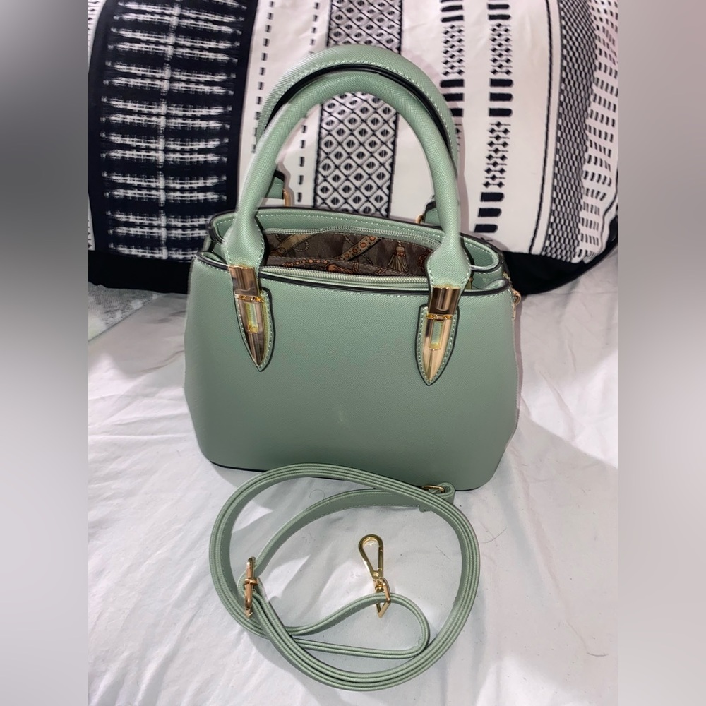 New light green purse never used before, has two ways of wearing it